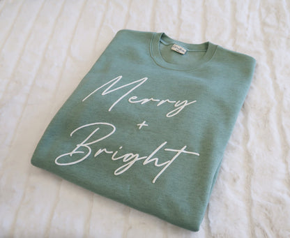 MERRY AND BRIGHT PUFF Graphic Sweatshirt Oat Collective