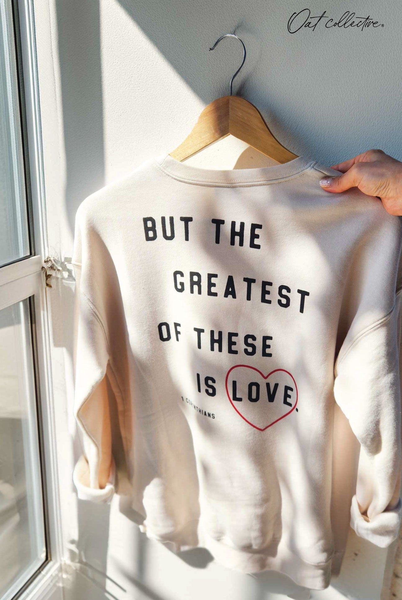 FRONT-FAITH HOPE LOVE BACK- BUT THE GREATEST OF THESE IS LOVE Fleece Pullover Relaxed Fit. Oat Collective